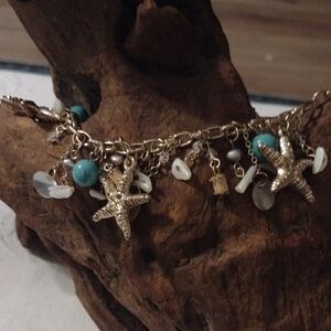 Gold Starfish Charm Bracelet with Turquoise and White Shell Accents